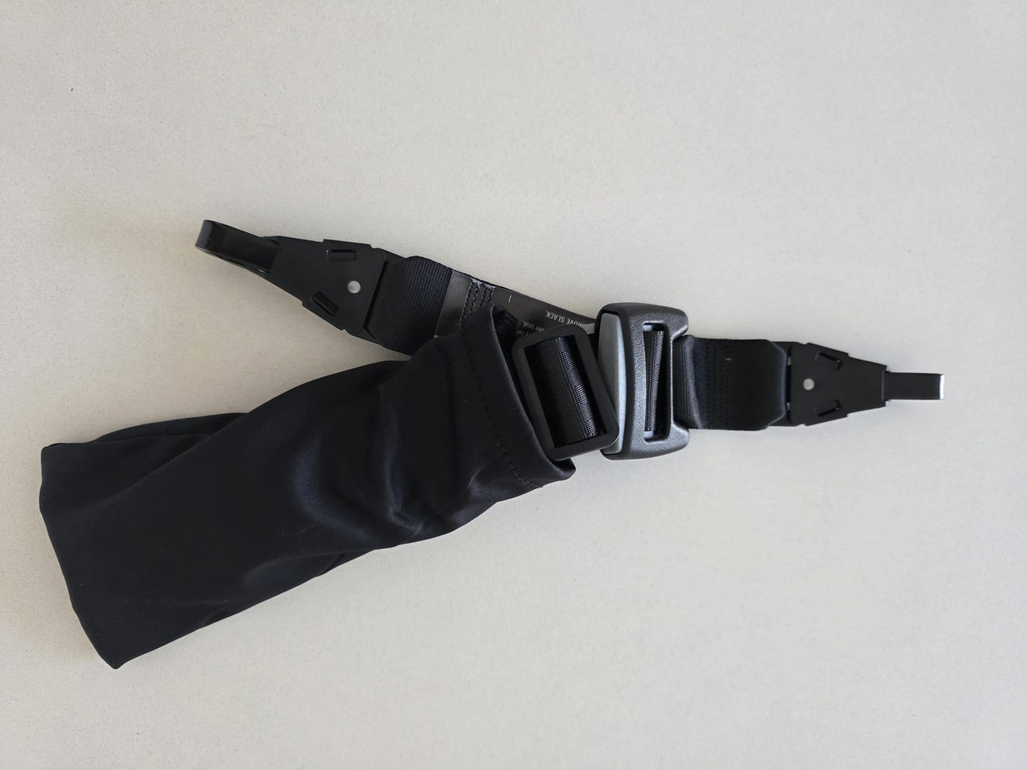 Correa de sujeción ajustable para cápsulas